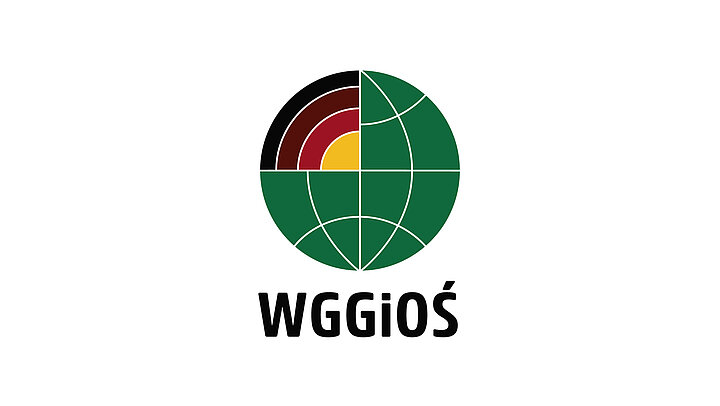The logo consists of a symbolic green globe with several meridians and parallels marked. The quarter circle represents colored circles symbolizing the Earth's layers. Beneath the symbol is the letter "WGGiOŚ"